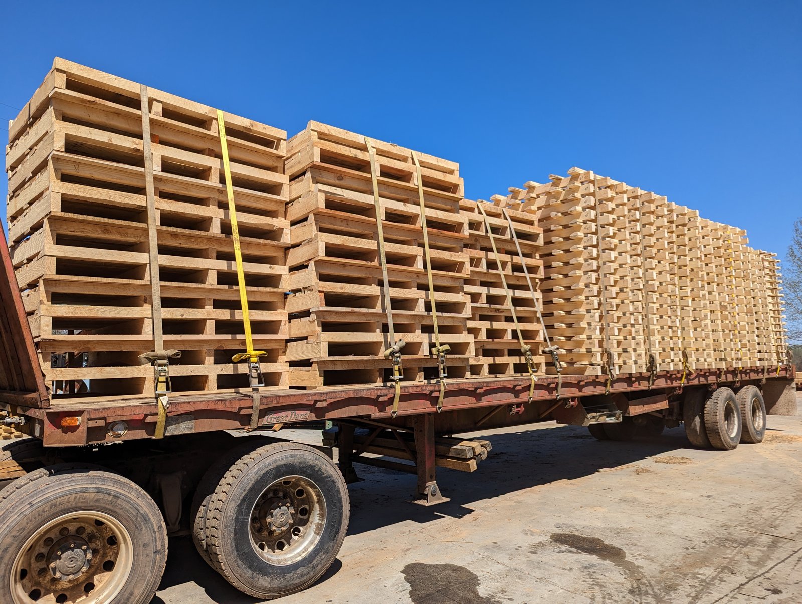 Stacked custom wood pallets at King Pallet Company in Liberty, SC